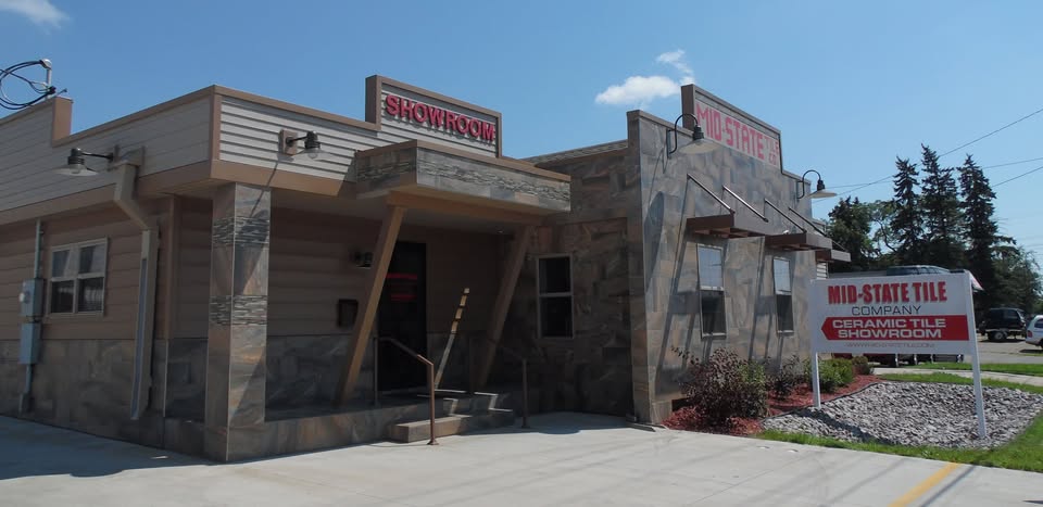 The Mid-State Tile Co. showroom on Lincoln Avenue in St. Cloud, faced in stone look tile, with the Ceramic Tile Showroom sign out front.